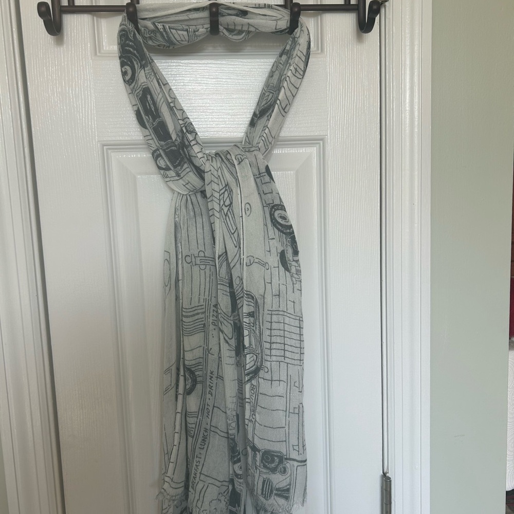 Women’s lightweight blue & white scarf with antique car theme. In used condition